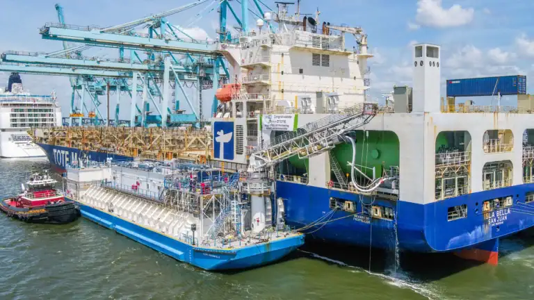 Tugboats and a large cargo ship docked at the port in Jacksonville.