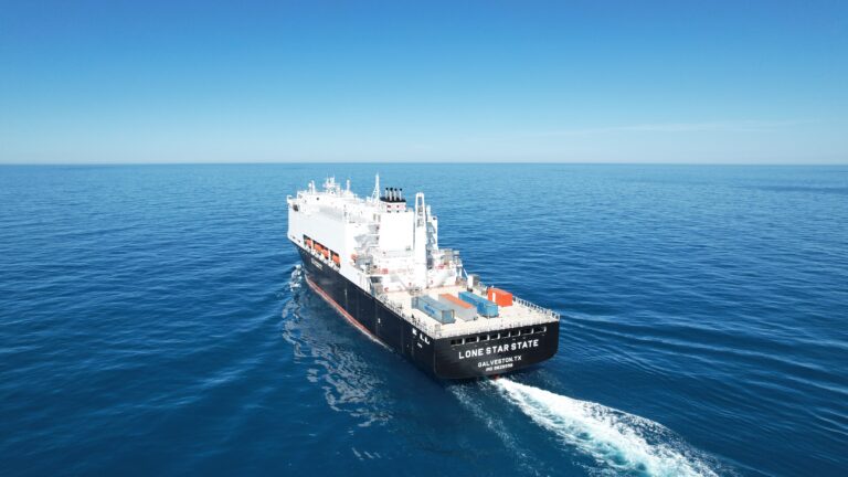 Large vessel named LONE STAR STATE sailing on open ocean.