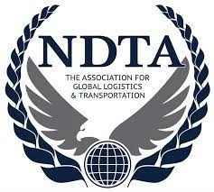 NDTA logo with eagle, globe, and laurel wreath design.