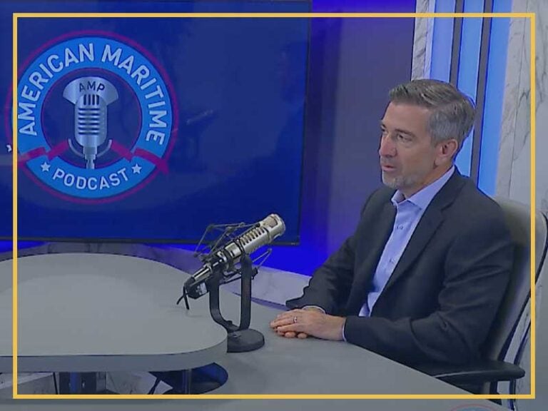 Expert discussing vessel construction management on a podcast show.