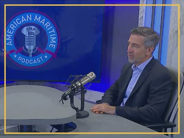Expert discussing vessel construction management on a podcast show.